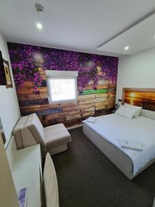 Postel nebo postele na pokoji v ubytování Garni Hotel & Spa Nicolo