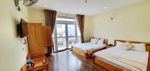 Giường trong phòng chung tại DALAMOON HOTEL