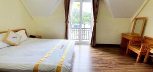 Giường trong phòng chung tại DALAMOON HOTEL
