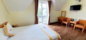 Giường trong phòng chung tại DALAMOON HOTEL