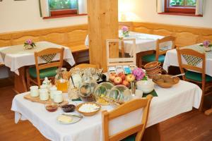 a table with a bunch of food on it at Turistična kmetija Stoglej in Luče