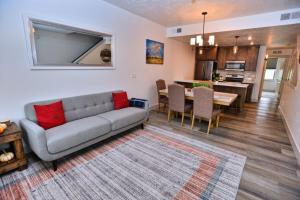 a living room with a couch and a dining room at The Highland Hangout by Casago McCall - Donerightmanagement in McCall