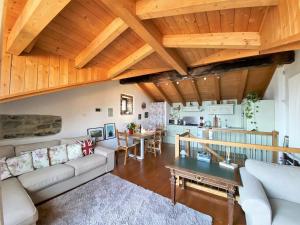 a living room with a couch and a table at Cà Milla Argegno apartment in Argegno