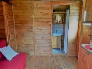a bathroom with a sink in a wooden cabin at Robinson House Istra Vižinada Poreč in Vižinada