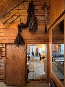 a view of a living room from the inside of a log cabin at Sakrisøy Rorbuer in Reine