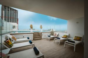 a large living room with a view of the ocean at V Hotel in St Julian's