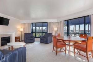 a living room with a table and chairs at Waterfront Hotel, part of JdV by Hyatt in Oakland