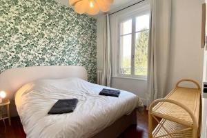 Giường trong phòng chung tại La Villa Dorange, EXCEPTIONNELLE et SPACIEUSE