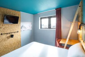 Postel nebo postele na pokoji v ubytování Birgit Hôtel Le Havre Centre