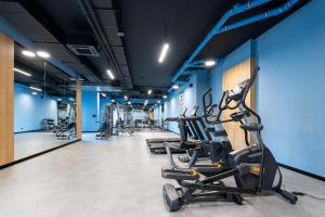 a row of exercise bikes in a gym at Apartament 1612 Modern Tower Gdynia in Gdynia