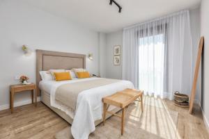 A bed or beds in a room at iloftmalaga SkyGarden