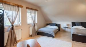 Posteľ alebo postele v izbe v ubytovaní 101 Apartman Agárd,Török Bálint utca 101