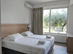 Postel nebo postele na pokoji v ubytování Saint Nicholas Hotel