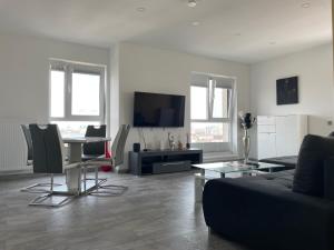 a living room with a couch and a table at Lakeview 2 Room Penthouse Rooftop Terrace W15 in Bucharest