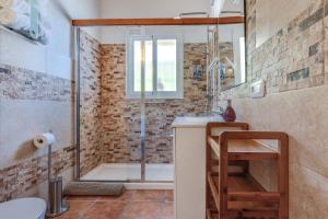 a bathroom with a shower and a sink and a toilet at Bed And Breakfast Mirador Infinito in Alhaurín el Grande +76 photos
