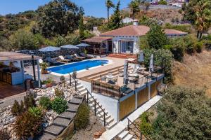 an aerial view of a villa with a swimming pool at Bed And Breakfast Mirador Infinito in Alhaurín el Grande