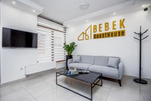 a living room with a couch and a table at Guesthouse Bebek in Sarajevo