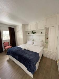 Säng eller sängar i ett rum på Apartamento Garza Blanca