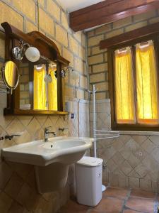a bathroom with a sink and a toilet at Villa Sofia in Lampedusa +55 photos