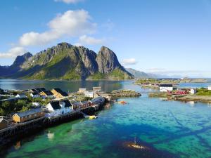 an aerial view of a town on a body of water at Sakrisøy Rorbuer in Reine