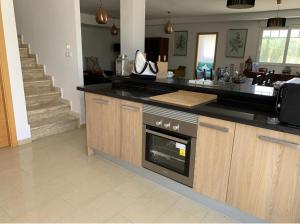 a kitchen with a counter with an oven in it at Stunning 3 bedroom rural apartment near Pinoso in Las Encebras