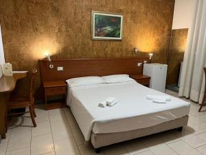 Ένα ή περισσότερα κρεβάτια σε δωμάτιο στο Hotel Adriatico