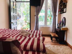 Postel nebo postele na pokoji v ubytování Homestay Vườn Tùng