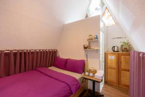 Postel nebo postele na pokoji v ubytování Homestay Vườn Tùng