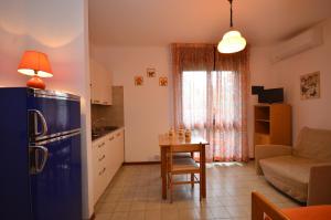 A kitchen or kitchenette at Appartamenti Alemagna