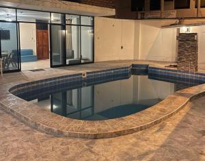 a large swimming pool in a building at Casa completa piscina 3 Habitaciones en Chanchamayo in La Merced +8 photos