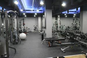 a gym with a lot of equipment in a room at Vienna House by Wyndham Andel's Prague in Prague