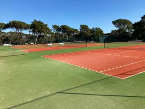 a tennis court with two tennis nets on it at CALYPSO in Biograd na Moru