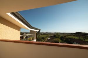 Un balcon sau o terasă la EUCALIPTO, splendido con terrazza panoramica sulla campagna versiliese