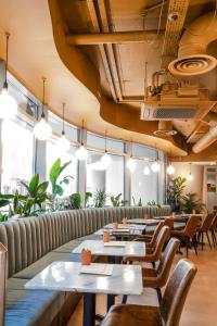 a row of tables and chairs in a restaurant at My Brighton in Brighton & Hove