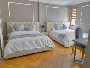 Een bed of bedden in een kamer bij The Alcove Apartment Vung Tau