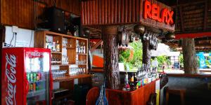 a bar with a coke machine in a room at Phi Phi Relax Beach Resort in Phi Phi Islands