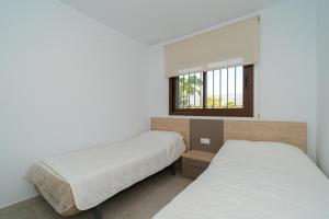 Postel nebo postele na pokoji v ubytování Mimosa