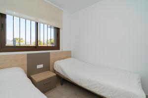 Postel nebo postele na pokoji v ubytování Mimosa