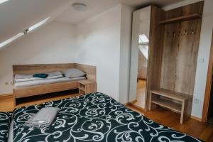 Postel nebo postele na pokoji v ubytování Apartmány Strážnice