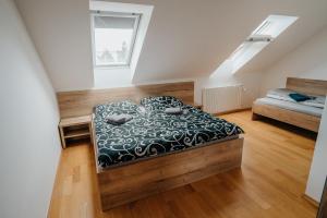 Postel nebo postele na pokoji v ubytování Apartmány Strážnice