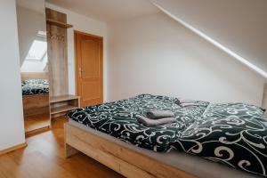 Postel nebo postele na pokoji v ubytování Apartmány Strážnice