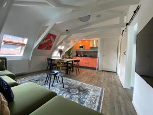 a living room with a couch and a table at Casa Coral - a hidden gem for families in Groningen