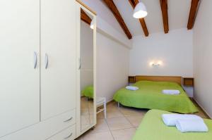 Posteľ alebo postele v izbe v ubytovaní Orka Apartments