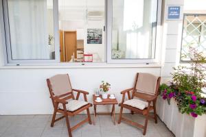two chairs and a table on a porch at Apartment Larissa in Dubrovnik