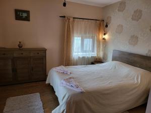 Postel nebo postele na pokoji v ubytování Vila Magnolia