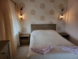 Postel nebo postele na pokoji v ubytování Vila Magnolia