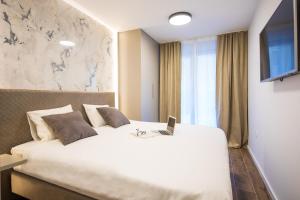 Postel nebo postele na pokoji v ubytování Downtown Oasis