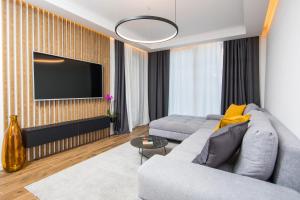 TV a/nebo společenská místnost v ubytování Downtown Oasis