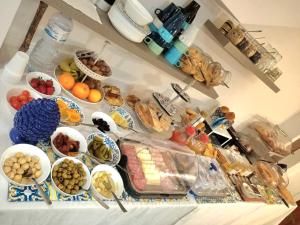 a variety of foods are displayed on a buffet table at Gocce di Girgenti - comfort suites in Agrigento