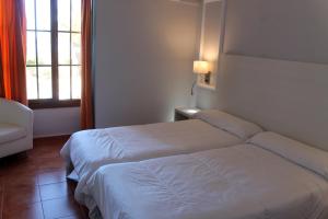 Postel nebo postele na pokoji v ubytování Hotel Bahia Sur